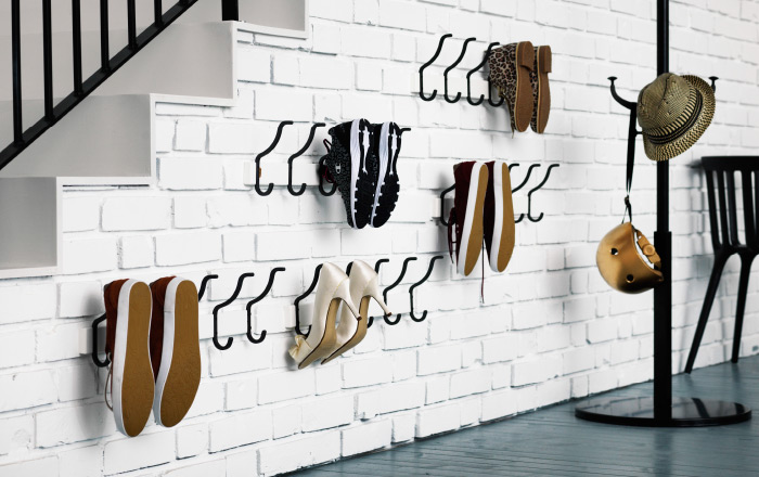 Organized closets // how to organize your shoes // shoe storage ideas // extra storage // DIY shoe storage // small space storage solutions // entryway shoe hooks // www.SimplySpaced.com